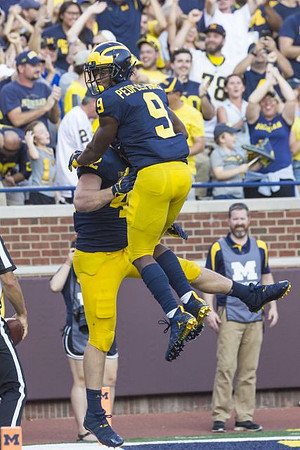 Ben Mason (42) and Donovan Peoples-Jones (9)