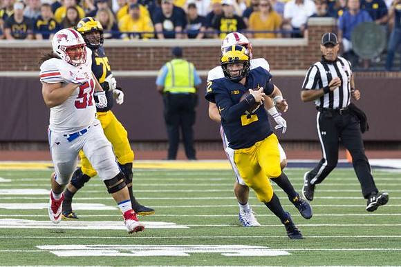 Jon Runyan Jr. (75) and Shea Patterson (2)