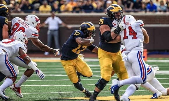 Zach Gentry (83), Chris Evans (12), and Jon Runyan Jr. (75)
