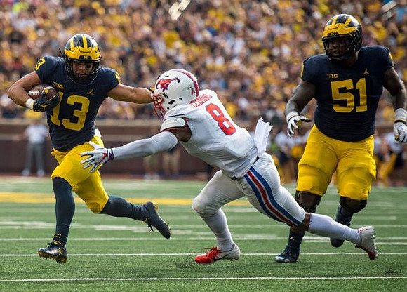 Tru Wilson (13) and Cesar Ruiz (51)