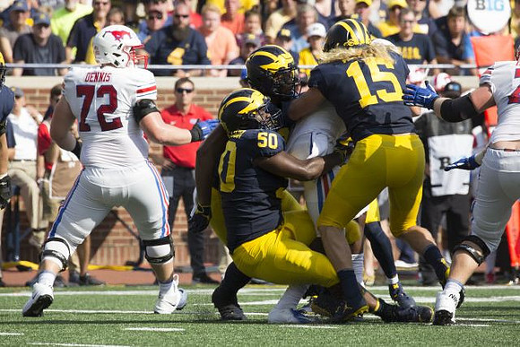 Michael Dwumfour (50) and Chase Winovich (15)
