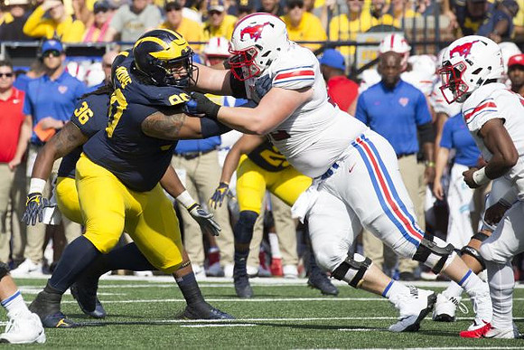 Bryan Mone (90) and Devin Gil (36)