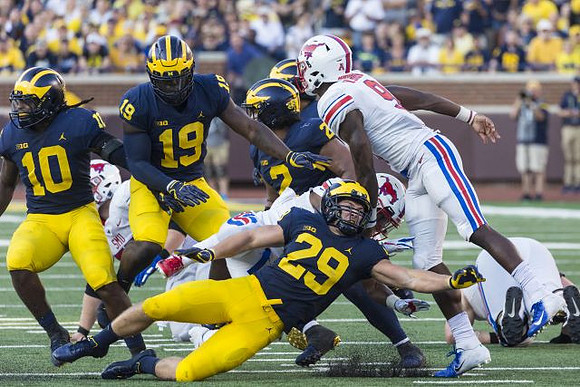 Devin Bush (10), Kwity Paye (19), Jordan Glasgow (29), and Carlo Kemp (2)