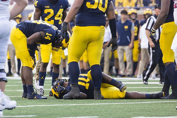 Josh Metellus (14), Lavert Hill (24), Bryan Mone (90), and Devin Bush (10)