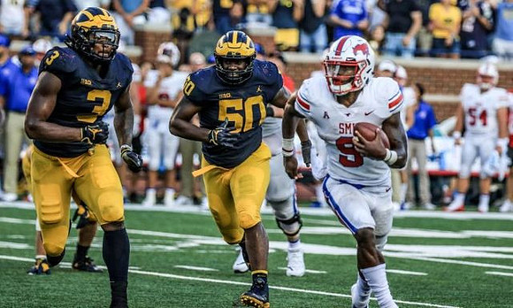 Rashan Gary (3) and Michael Dwumfour (50)