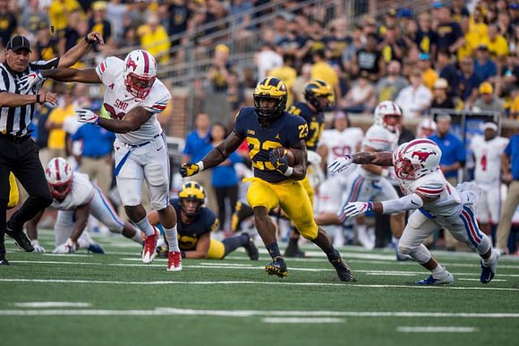 Shea Patterson (2), O'Maury Samuels (23), and Ben Bredeson (74)