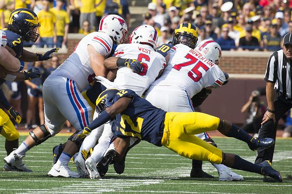 Carlo Kemp (2), Josh Ross (12), and Devin Bush (10)