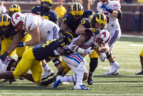 Josh Metellus (14), Carlo Kemp (2), and Chase Winovich (15)