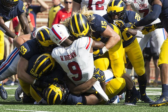 Rashan Gary (3), Noah Furbush (59), Chase Winovich (15), and Brad Hawkins (20)