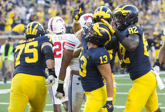 Jon Runyan Jr. (75), Tru Wilson (13), and Nick Eubanks (82)