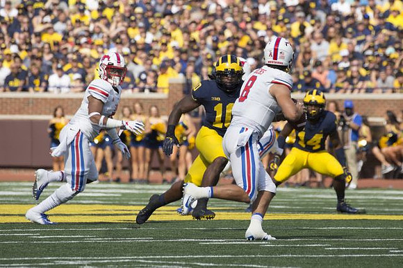 Devin Bush (10) and Josh Metellus (14)