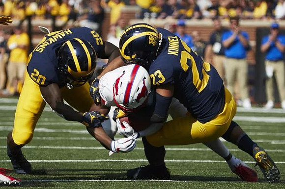 Brad Hawkins (20) and Tyree Kinnel (23)