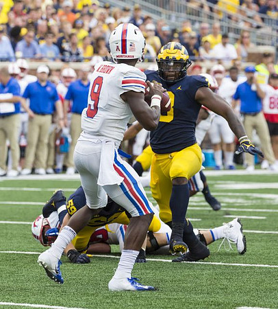 Noah Furbush (59) and Rashan Gary (3)