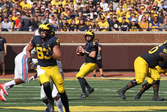 Zach Gentry (83), Shea Patterson (2), and Michael Onwenu (50)