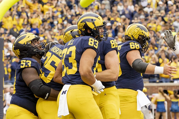 Trente Jones (53), Hassan Haskins (25), Erick All (83), Luke Schoonmaker (86), and Andrew Vastardis (68)