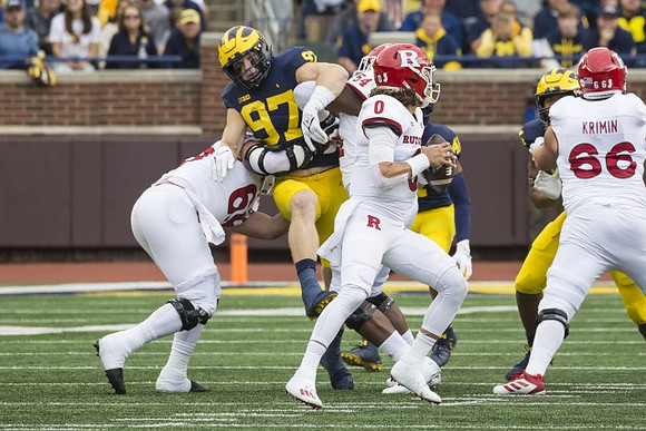 Aidan Hutchinson (97), and Nikhai Hill-Green (41)