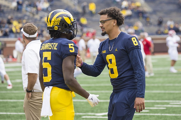 Mike Sainristil (5), and Ronnie Bell (8)