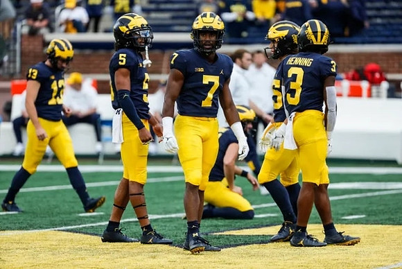 Jake Moody (13), Mike Sainristil (5), Donovan Edwards (7), and A.J. Henning (3)
