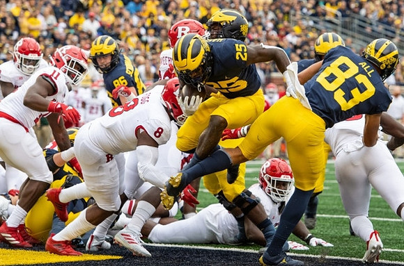 Luke Schoonmaker (86), Hassan Haskins (25), and Erick All (83)