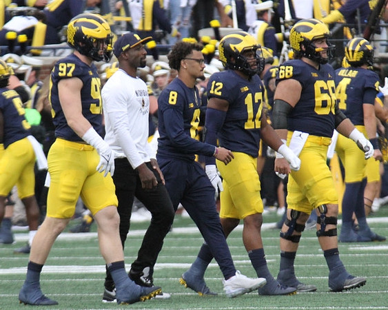 Aidan Hutchinson (97), Ronnie Bell (8), Josh Ross (12), and Andrew Vastardis (68)