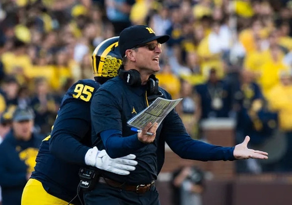 Donovan Jeter (95), and Jim Harbaugh