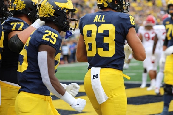 Trevor Keegan (77), Hassan Haskins (25), and Erick All (83)
