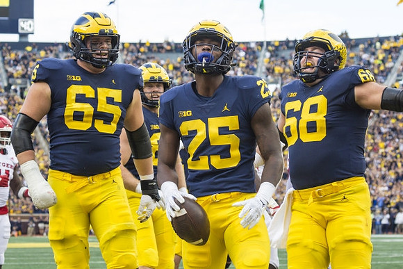 Zak Zinter (65), Hassan Haskins (25), and Andrew Vastardis (68)
