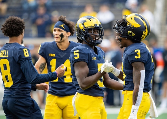 Ronnie Bell (8), Roman Wilson (14), Mike Sainristil (5), and A.J. Henning (3)
