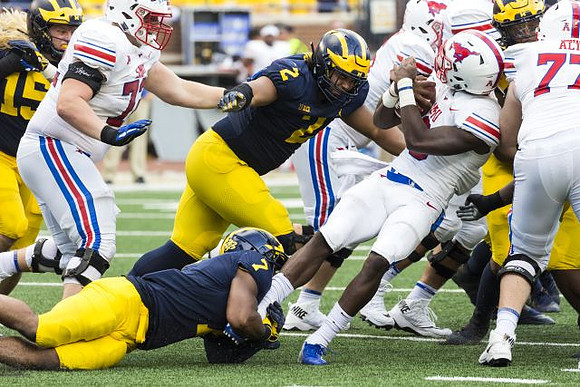 Chase Winovich (15), Khaleke Hudson (7), and Carlo Kemp (2)