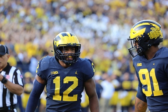 Josh Ross (12), and Taylor Upshaw (91)