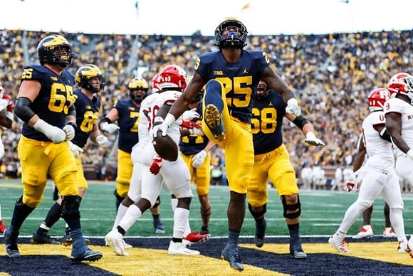 Zak Zinter (65), Hassan Haskins (25), and Andrew Vastardis (68)