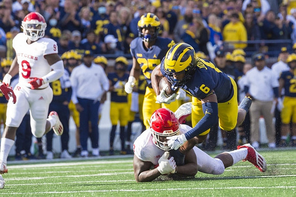 Cornelius Johnson (6), and Hassan Haskins (25)