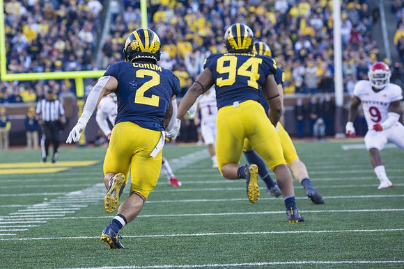 Blake Corum (2), and Kris Jenkins (94)