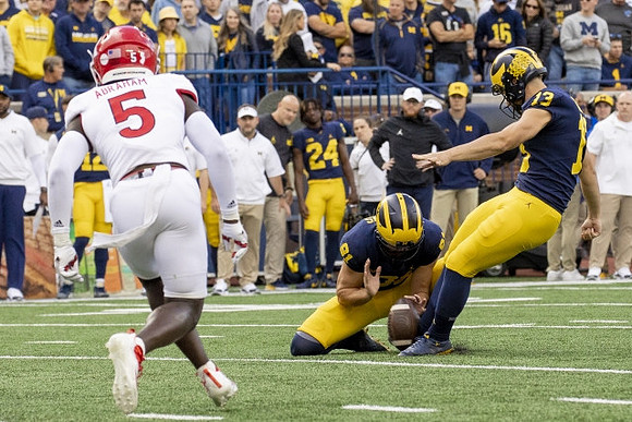 Brad Robbins (91), and Jake Moody (13)