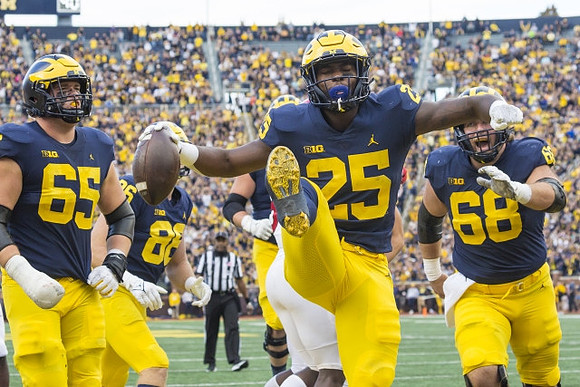 Zak Zinter (65), Luke Schoonmaker (86), Hassan Haskins (25), and Andrew Vastardis (68)