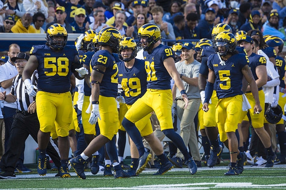 Brad Robbins (91), and Michigan Team