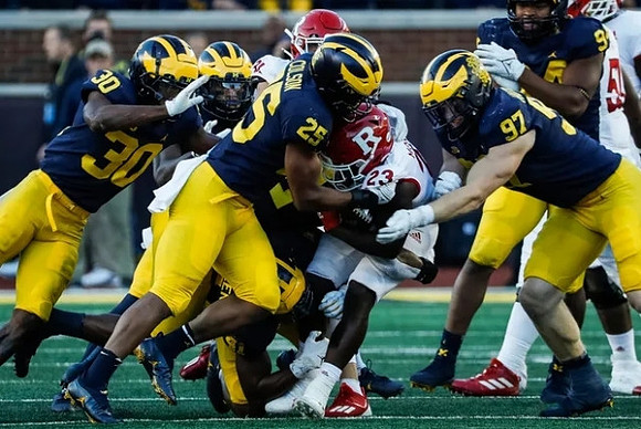 Daxton Hill (30), Junior Colson (25), Aidan Hutchinson (97), and Kris Jenkins (94)