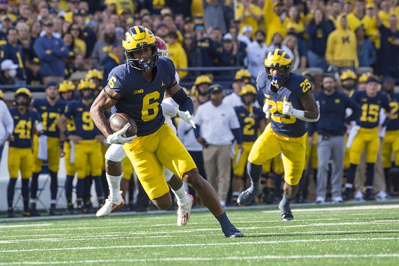 Cornelius Johnson (6), and Hassan Haskins (25)