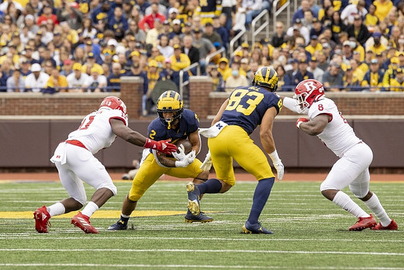 Blake Corum (2), and Erick All (83)