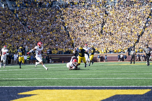 Hassan Haskins (25), and Cornelius Johnson (6)