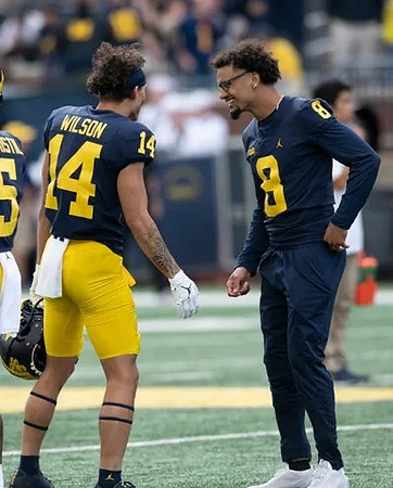 Mike Sainristil (5), Roman Wilson (14), and Ronnie Bell (8)