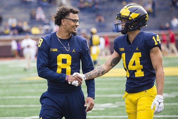 Ronnie Bell (8), and Roman Wilson (14)