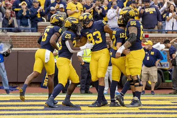 Cornelius Johnson (6), Hassan Haskins (25), Erick All (83), Cade McNamara (12), and Chuck Filiaga (66)