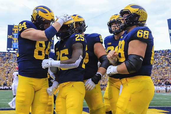 Joel Honigford (84), Hassan Haskins (25), Chuck Filiaga (66), and Andrew Vastardis (68)