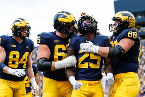 Joel Honigford (84), Zak Zinter (65), Hassan Haskins (25), and Andrew Vastardis (68)
