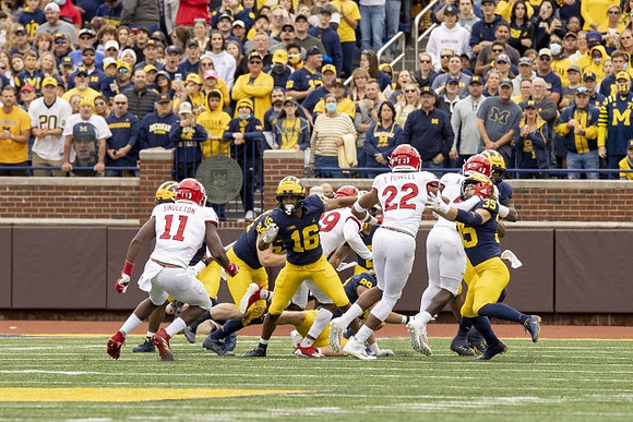 Joel Honigford (84), Jalen Perry (16), and Caden Kolesar (35)
