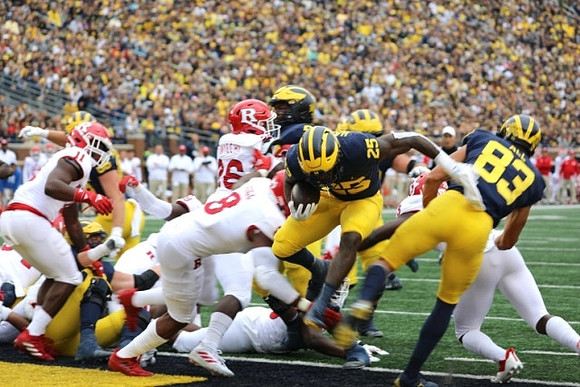 Hassan Haskins (25), and Erick All (83)