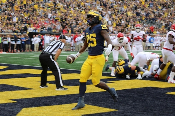 Hassan Haskins (25), and Andrew Stueber (71)
