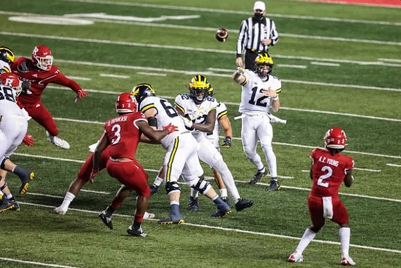 Nick Eubanks (82) and Cade McNamara (12)