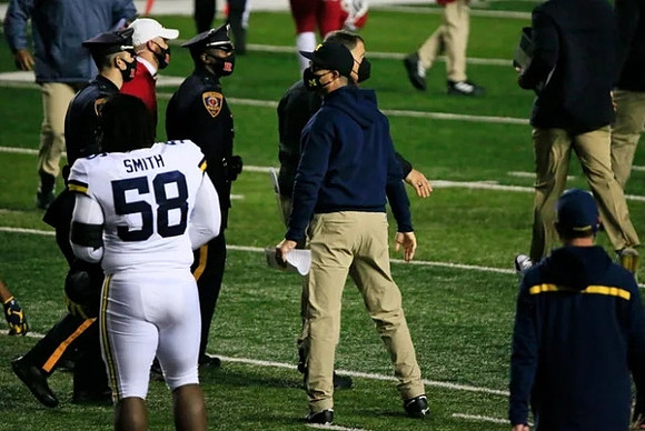 Mazi Smith (58) and Jim Harbaugh